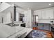 Bright kitchen features a peninsula island, marbled countertops, subway tile backsplash, and stainless steel appliances at 704 Valleywater St, Fuquay Varina, NC 27526