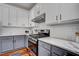 Updated kitchen with white subway tile backsplash, and stainless steel appliances at 704 Valleywater St, Fuquay Varina, NC 27526