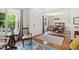 Open-concept living area with hardwood floors and dining area filled with natural light at 704 Valleywater St, Fuquay Varina, NC 27526