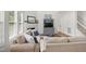 Comfortable living room featuring a fireplace, soft lighting, and neutral decor, perfect for Gathering time at 704 Valleywater St, Fuquay Varina, NC 27526