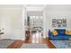 Bright living room with hardwood floors and large windows, offering a spacious, welcoming feel at 704 Valleywater St, Fuquay Varina, NC 27526