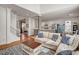 Spacious living room that opens to the kitchen with hardwood floors, comfortable furniture, and plenty of light at 704 Valleywater St, Fuquay Varina, NC 27526