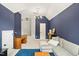 Spacious living room with blue walls, a comfortable sofa, and great lighting at 704 Valleywater St, Fuquay Varina, NC 27526
