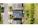 Aerial view of backyard featuring mature trees, fire pit and patio area with lush landscaping at 79 Tarwick Ave, Chapel Hill, NC 27516