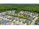 An aerial view of a neighborhood showcasing manicured lawns and mature trees at 79 Tarwick Ave, Chapel Hill, NC 27516