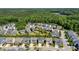 An aerial view showing a neighborhood surrounded by lush greenery, highlighting the community's serene setting at 79 Tarwick Ave, Chapel Hill, NC 27516