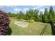 Well-maintained backyard with lush landscaping, mature trees, and a garden at 79 Tarwick Ave, Chapel Hill, NC 27516
