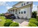 Well-maintained backyard with lush landscaping, patio, grill, and access to screened porch at 79 Tarwick Ave, Chapel Hill, NC 27516