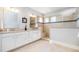 Luxurious bathroom features a double vanity, tile flooring, and a walk-in shower at 79 Tarwick Ave, Chapel Hill, NC 27516
