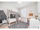 A whimsical bedroom featuring a tent-style bed, gray carpet and charming decor at 79 Tarwick Ave, Chapel Hill, NC 27516