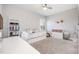 Comfortable bedroom features neutral carpeting, a daybed, and lots of natural light at 79 Tarwick Ave, Chapel Hill, NC 27516