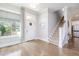 Inviting foyer features hardwood floors, a staircase, and lots of natural light at 79 Tarwick Ave, Chapel Hill, NC 27516