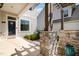 View of a covered front porch with stone pillars, offering a welcoming entrance to the home at 79 Tarwick Ave, Chapel Hill, NC 27516