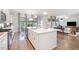 Open-concept kitchen with a large island, seamless access to living spaces, and stylish finishes at 79 Tarwick Ave, Chapel Hill, NC 27516