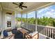 Relaxing screened porch with wooden furniture, ceiling fan, and nature views at 79 Tarwick Ave, Chapel Hill, NC 27516