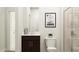 Bathroom featuring a toilet, vanity with dark wood cabinets and walk-in shower with glass door at 804 Cassa Clubhouse Way, Knightdale, NC 27545