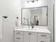 Bathroom featuring a framed mirror, sleek vanity with hardware, and modern fixtures at 810 Maple Berry Ln # 104, Raleigh, NC 27607