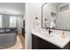 Bathroom with a vanity, white countertop, and a black framed mirror at 810 Maple Berry Ln # 104, Raleigh, NC 27607