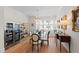 Bright dining room featuring a glass table, wine refrigerator, and stylish decor at 810 Maple Berry Ln # 104, Raleigh, NC 27607