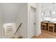 Hallway with wood floors, staircase, and a view of the kitchen at 810 Maple Berry Ln # 104, Raleigh, NC 27607