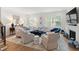 Bright and airy living room with large windows, comfortable seating, and a cozy atmosphere at 810 Maple Berry Ln # 104, Raleigh, NC 27607
