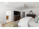 Main bedroom featuring a ceiling fan, hardwood floors, and access to an ensuite bathroom and walk-in closet at 810 Maple Berry Ln # 104, Raleigh, NC 27607