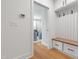 Mudroom area with white built-in storage, coat hooks, and a bench, offering functional organization at 810 Maple Berry Ln # 104, Raleigh, NC 27607