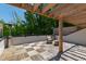 Inviting outdoor patio with wooden pergola, comfortable seating, and lush greenery at 810 Maple Berry Ln # 104, Raleigh, NC 27607