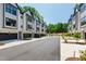 Street view of modern townhomes with black trim and attached garages at 810 Maple Berry Ln # 104, Raleigh, NC 27607