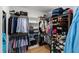 Organized walk-in closet with custom shelving, hanging rods, and storage for clothes, shoes, and accessories at 810 Maple Berry Ln # 104, Raleigh, NC 27607