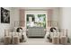 Bright bedroom features two twin beds, neutral colors, stylish decor, and a large window at 909 Crossbill Dr, Knightdale, NC 27545
