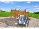 Well-maintained playground with slide on a bed of woodchips at 909 Crossbill Dr, Knightdale, NC 27545