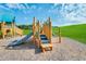 Community playground area with slides, climbing structures, and a wood chip surface on a sunny day at 909 Crossbill Dr, Knightdale, NC 27545
