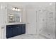 Beautiful bathroom complete with marble floors, glass shower, and navy blue vanity at 95 Black Walnut Dr # 191, Garner, NC 27529