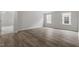 This is a well-lit bedroom with hardwood floors and two windows at 95 Black Walnut Dr # 191, Garner, NC 27529