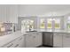 Bright kitchen with white cabinets, stainless steel appliances, and large island with quartz countertops at 95 Black Walnut Dr # 191, Garner, NC 27529