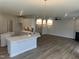 Open kitchen features modern cabinetry, an island with seating, and recessed lighting at 95 Black Walnut Dr # 191, Garner, NC 27529