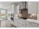 Modern kitchen with white cabinets, stainless steel appliances, and decorative backsplash at 95 Black Walnut Dr # 191, Garner, NC 27529