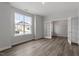 Bright living room with hardwood floors, large windows, and a glass paneled door at 95 Black Walnut Dr # 191, Garner, NC 27529