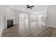 Bright and airy living space with fireplace, hardwood floors, ceiling fan and open layout at 95 Black Walnut Dr # 191, Garner, NC 27529