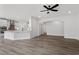 Expansive living area featuring hardwood floors, fireplace, ceiling fan, and an open kitchen at 95 Black Walnut Dr # 191, Garner, NC 27529