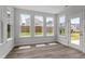 Sunroom with hardwood floors, bright windows, and access to backyard at 95 Black Walnut Dr # 191, Garner, NC 27529