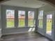 Light-filled sunroom with a view of the green backyard and ample windows at 95 Black Walnut Dr # 191, Garner, NC 27529