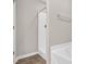 The bathroom has a shower/tub combination, white fixtures, and sleek tile flooring at 9805 Precious Stone Dr, Wake Forest, NC 27587