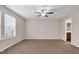 Spacious bedroom with neutral walls and carpet flooring, complemented by natural light from windows at 9805 Precious Stone Dr, Wake Forest, NC 27587
