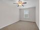 Cozy bedroom with neutral walls, carpet flooring, and a window, offering a relaxing retreat at 9805 Precious Stone Dr, Wake Forest, NC 27587