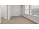 Well-lit bedroom featuring neutral paint, carpet, window and closet space at 9805 Precious Stone Dr, Wake Forest, NC 27587