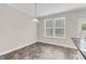 Bright dining area with two windows and modern light fixture at 9805 Precious Stone Dr, Wake Forest, NC 27587