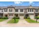 Charming townhome with stone accents, well-maintained landscaping, and attached garages at 9805 Precious Stone Dr, Wake Forest, NC 27587