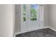 Bright foyer featuring a stylish tile floor and a view of the lush outdoor landscape through glass doors at 9805 Precious Stone Dr, Wake Forest, NC 27587